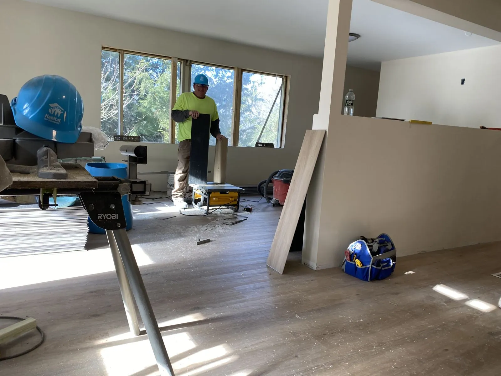 Sunlit room in a Habitat home with new flooring being installed